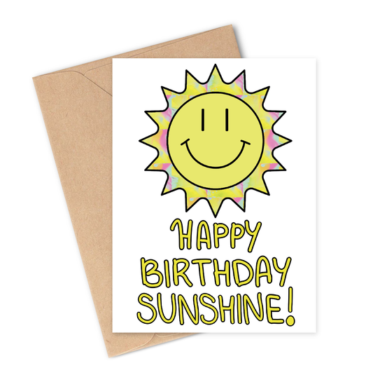 Greeting card with a sun illustration and 'Happy Birthday Sunshine!' text on a white background with brown envelope.