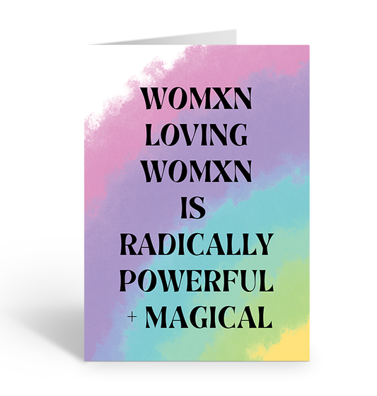 Greeting card with colorful watercolor background and text 'WOMXN LOVING WOMXN IS RADICALLY POWERFUL + MAGICAL' on a white background.