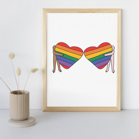 Rainbow Heart Hugs POC & Pinkie Pride A4 Fine Art Print on minimalist desk.