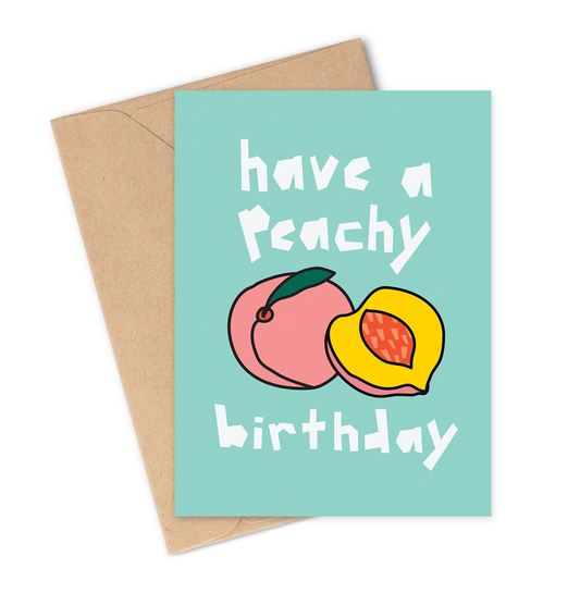 Greeting card with peaches and text 'have a Peachy birthday' on a light green bluey background with a brown envelope.