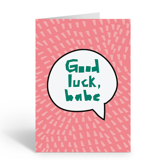 Greeting card with 'Good luck, babe' text in a speech bubble on a pink patterned background