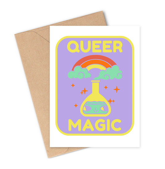 Greeting card with 'Queer Magic' design featuring a rainbow and test tube on a purple background, with a brown envelope.