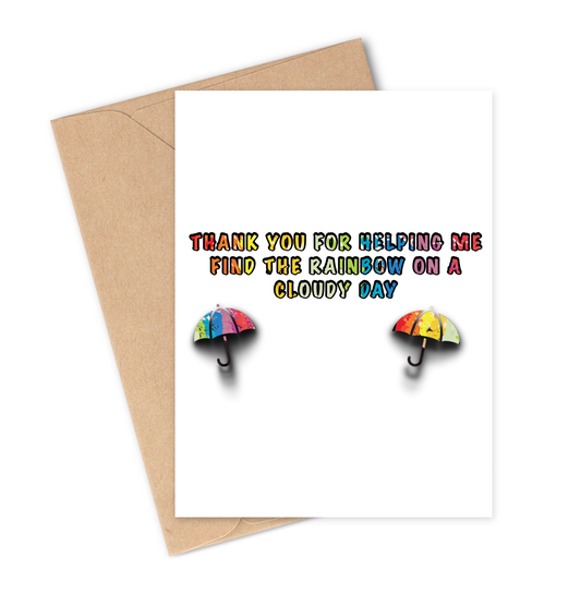 Greeting card with rainbow umbrellas and text Thank you for helping me find the rainbow on a cloudy day on a white background with brown envelope.