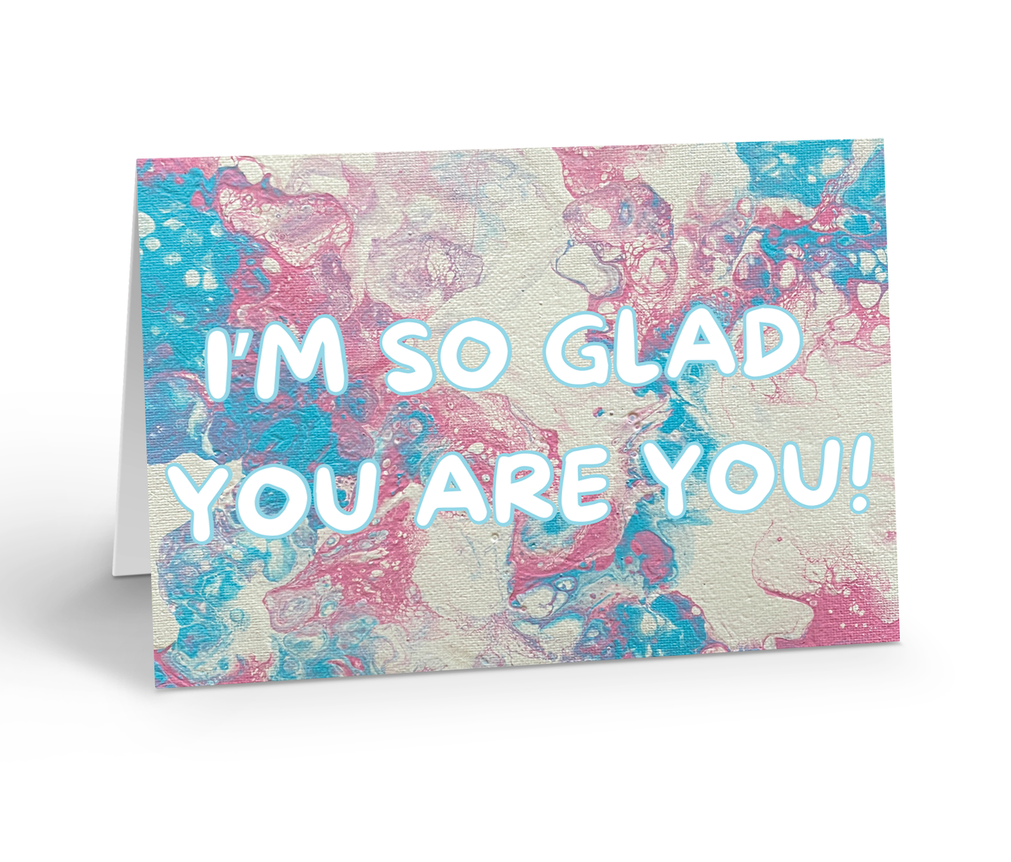 Greeting card with marbled design and text 'I'm so glad you are you!' on a trans pride flag coloured background