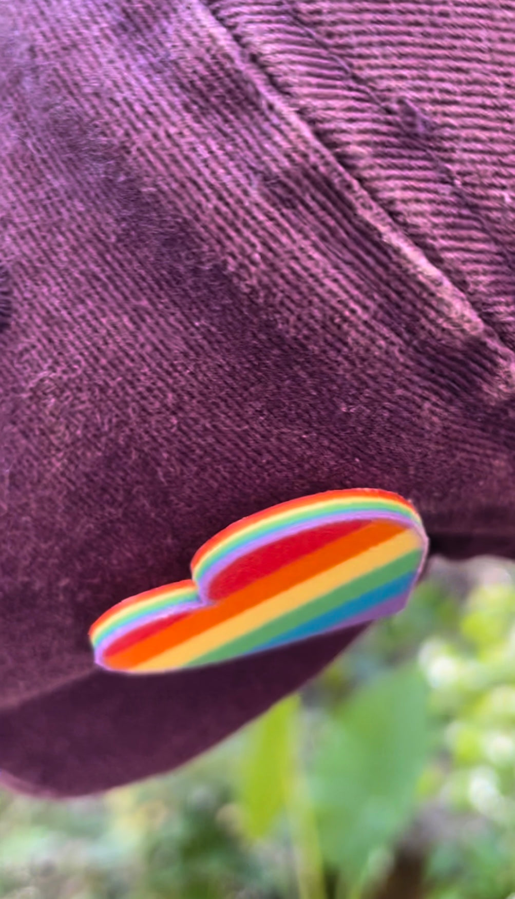 Rainbow border on rainbow pride heart pin