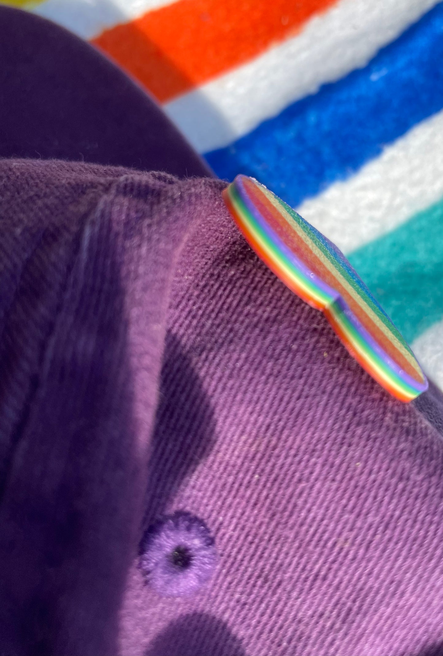 Rainbow border on rainbow pride heart pin